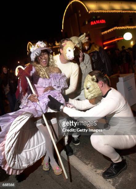 Couple of sheep take a peep at Little Bo Peep during the West Hollywood Halloween Carnival along Santa Monica Boulevard on October 31, 2000 in...