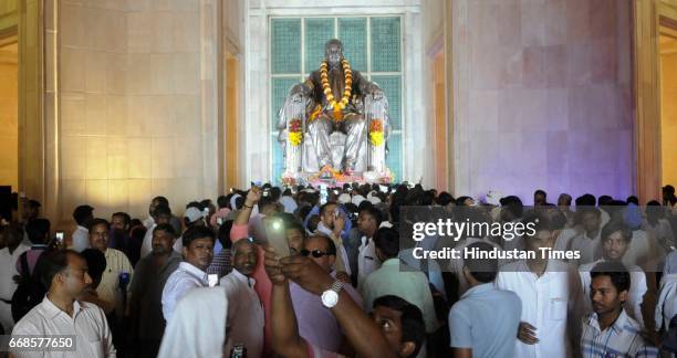 Supporters in front of Ambedkar's statue on birth anniversary of Bharat Ratn Dr. Bhimrao Ambedkar at Ambedkar park on April 14, 2017 in Lucknow,...