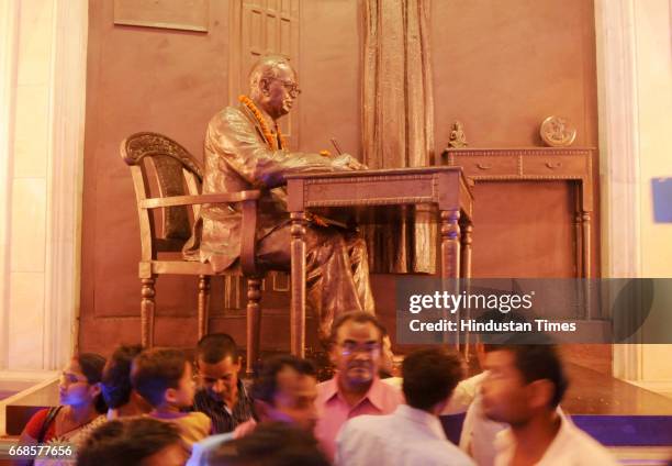 Supporters viewing the gallery of Ambedkar's life on his birth anniversary of Bharat Ratn Dr. Bhimrao Ambedkar at Ambedkar park on April 14, 2017 in...