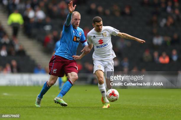 Neil Bishop of Scunthorpe United and Stuart OÕKeefe of MK Dons during the Sky Bet League One match between MK Dons and Scunthorpe United at StadiumMK...