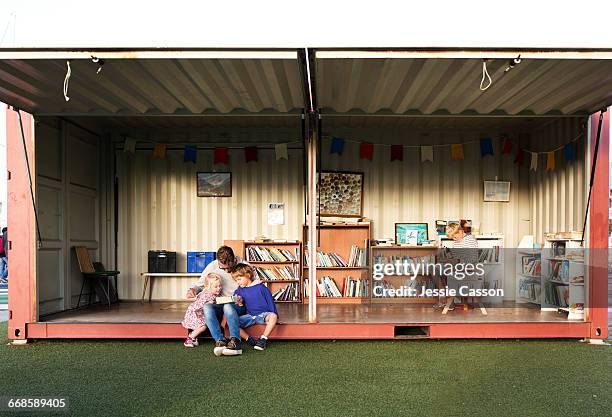 shipping container used as a free library - open day 11 stock pictures, royalty-free photos & images