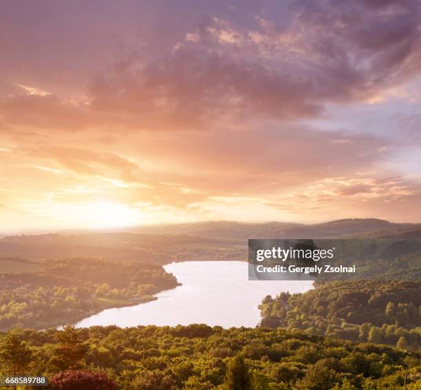 beautiful sunset on a lake in the background - pecs hungary stock pictures, royalty-free photos & images