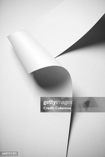 detail shot of wavy paper and shadow - rolled up stock pictures, royalty-free photos & images