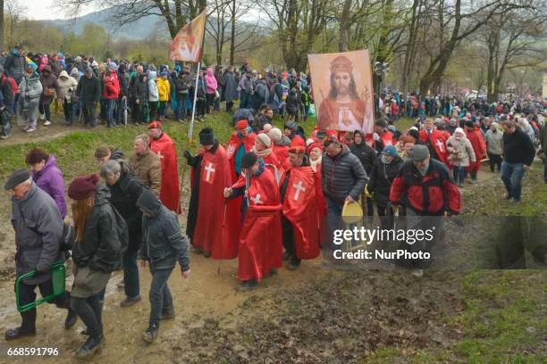 Suspended Fr. Piotr Natanek (carying a banner and members of the Order of Knights of Christ the King during the reenactment of the Way of the Cross...