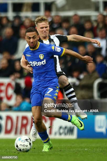 Kemar Roofe of Leeds United and Matt Ritchie of Newcastle United during the Sky Bet Championship match between Newcastle United and Leeds United at...
