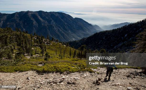 Sam Kim nears the summit of Mt. Baldy, a trek he has made more than 700 times in Mt. Baldy, Calif., on Dec. 14, 2016.