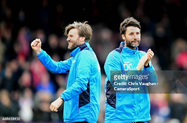 Lincoln City's assistant manager Nicky Cowley, left, and Lincoln City manager Danny Cowley at the end of the Vanarama National League match between...