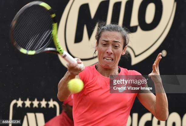Francesca Schiavone of Italy plays a backhand against Johanna Larsson of Switzerland during a semifinal match as part of Claro Open Colsanitas WTA...