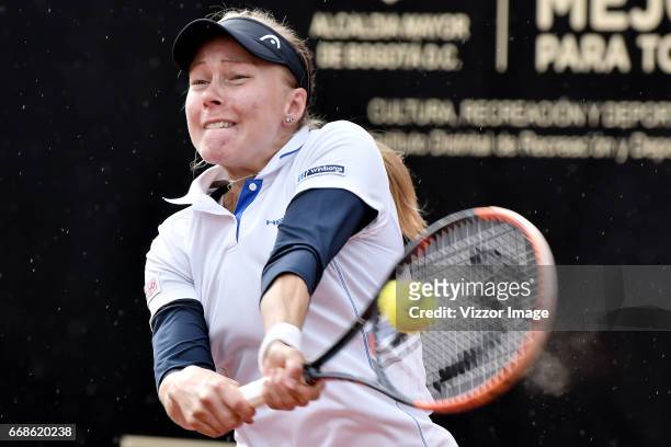 Johanna Larsson of Switzerland plays a forehand against Francesca Schiavone of Italy during a semifinal match as part of Claro Open Colsanitas WTA...