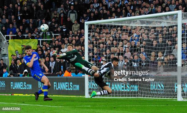 Leeds United Goalkeeper Robert Green makes a diving save as Ayoze Perez of Newcastle United also dives in the air looking to head the ball into goal...