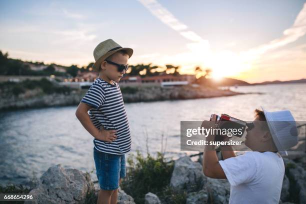 brothers in the sunset filimng - young film director stock pictures, royalty-free photos & images