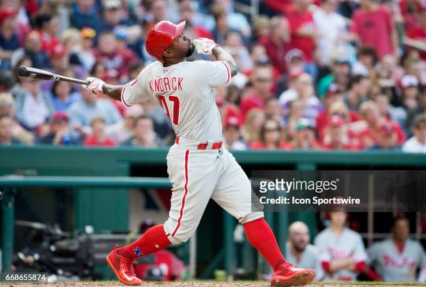 Philadelphia Phillies left fielder Howie Kendrick tracks the trajectory of his hit during a MLB game between the Washington Nationals and the...