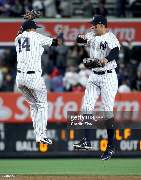 Starlin Castro and Aaron Judge of the New York Yankees celebrate the 4-3 win over the St. Louis Cardinals on April 14, 2017 at Yankee Stadium in the...