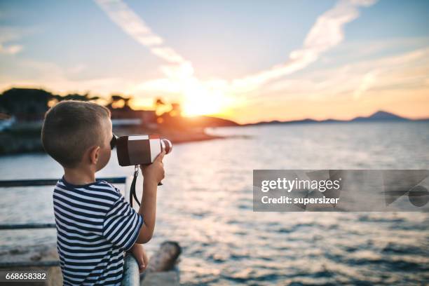 brothers in the sunset filimng - child film director stock pictures, royalty-free photos & images