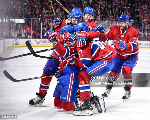 Alexander Radulov of the Montreal Canadiens celebrates his overtime goal with teammates against the New York Rangers in Game Two of the Eastern...