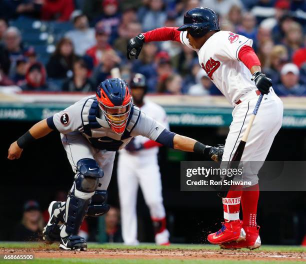 Alex Avila of the Detroit Tigers tags out Jose Ramirez of the Cleveland Indians after dropping a third strike during the second inning at Progressive...