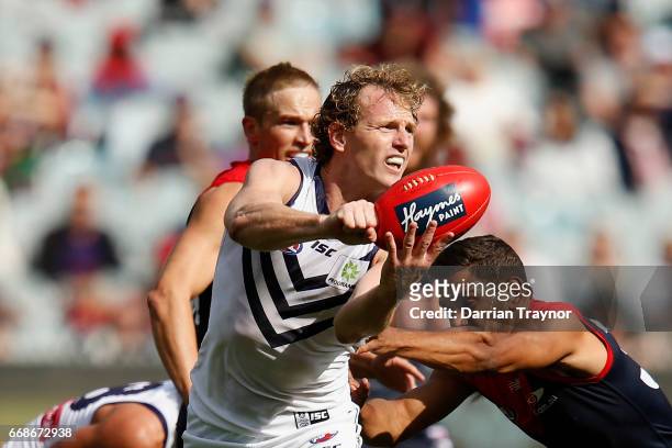 David Mundy of the Dockers handballs during the round four AFL match between the Melbourne Demons and the Fremantle Dockers at Melbourne Cricket...