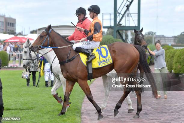 Daniel Stackhouse returns to the mounting yard on Schneller after winning Bert Bryant Handicap at Caulfield Racecourse on April 15, 2017 in...