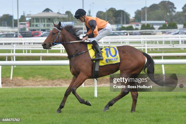 Daniel Stackhouse returns to the mounting yard on Schneller after winning Bert Bryant Handicap at Caulfield Racecourse on April 15, 2017 in...