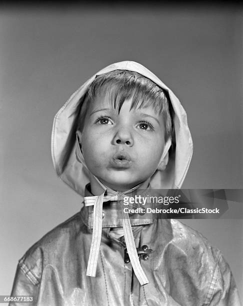 1950s PORTRAIT BOY WEARING RAIN HAT AND SLICKER COAT