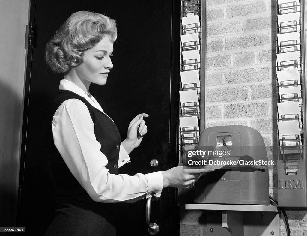 1960s WOMAN PUNCHING TIME...
