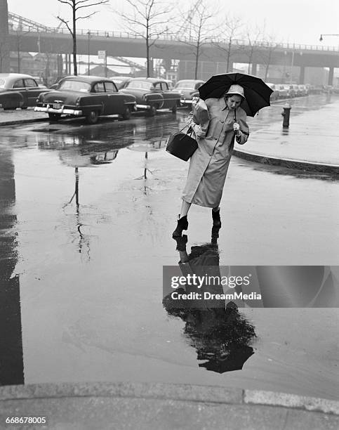 Avoid Puddle Stepping Into Puddle Photos and Premium High Res Pictures - Getty Images