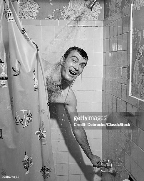 1950s MAN IN SHOWER TURNING ON WATER AND PULLING SHOWER CURTAIN CLOSED