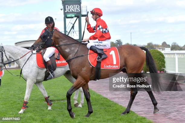 Beau Mertens returns to the mounting yard on Boom Time after winning Robert Taranto Handicap at Caulfield Racecourse on April 15, 2017 in Caulfield,...