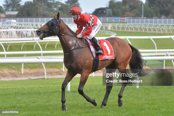 Beau Mertens returns to the mounting yard on Boom Time after winning Robert Taranto Handicap at Caulfield Racecourse on April 15, 2017 in Caulfield,...