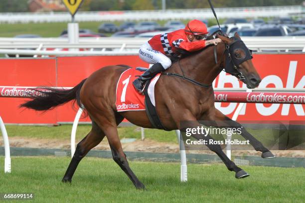 Boom Time ridden by Beau Mertens wins the Robert Taranto Handicap at Caulfield Racecourse on April 15, 2017 in Caulfield, Australia.