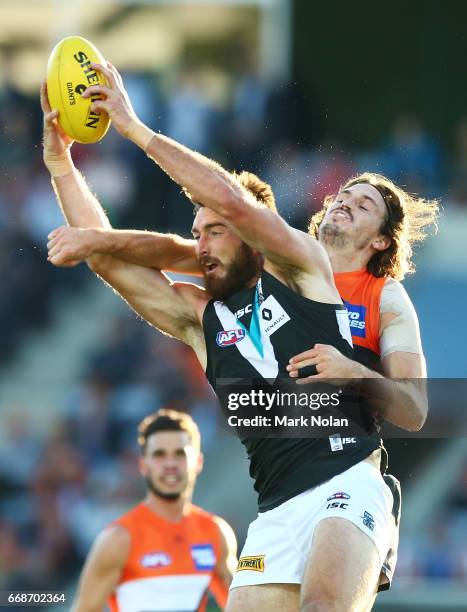 Charlie Dixon of the Power and Phil Davis of the Giants contest a mark during the round four AFL match between the Greater Western Sydney Giants and...