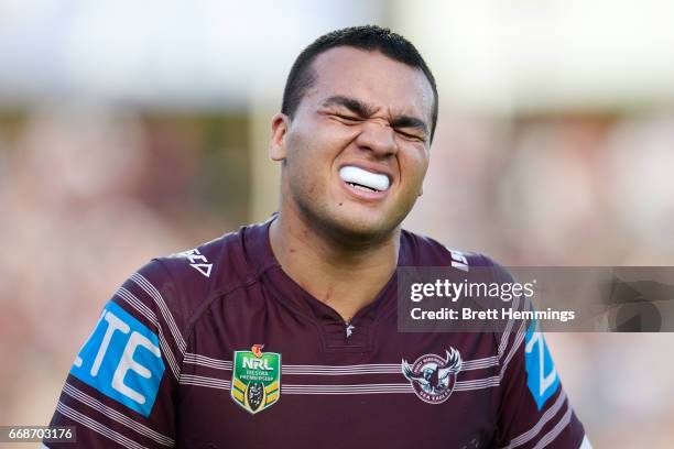 Lloyd Perrett of Manly is assisted from the field during the round seven NRL match between the Manly Sea Eagles and the Melbourne Storm at Lottoland...