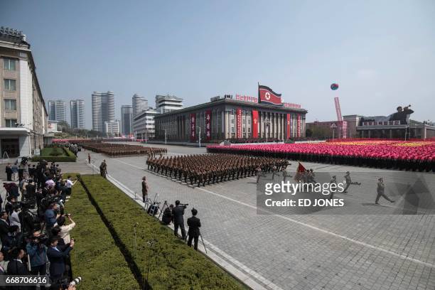 Korean People's Army soldiers march on Kim Il-Sung squure during a military parade marking the 105th anniversary of the birth of late North Korean...