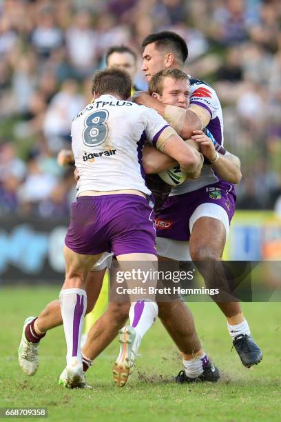 Jake Trbojevic of Manly is tackled during the round seven NRL match between the Manly Sea Eagles and the Melbourne Storm at Lottoland on April 15,...