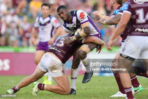 Suliasi Vunivalu of the Storm is tackled during the round seven NRL match between the Manly Sea Eagles and the Melbourne Storm at Lottoland on April...
