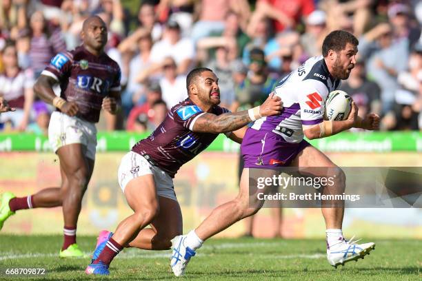 Curtis Sironen of Manly is tackled during the round seven NRL match between the Manly Sea Eagles and the Melbourne Storm at Lottoland on April 15,...