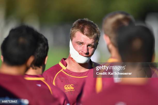 Sam Godwin of University leaves the field due to an injury during the Hawkins Premier Cup match between Canterbury University and Belfast RFC at Ilam...