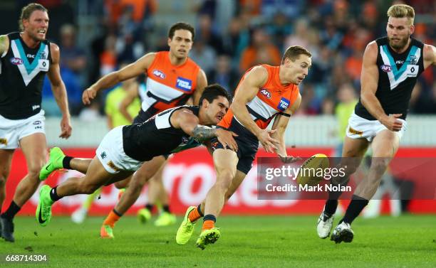 Devon Smith of the Giants is tackled during the round four AFL match between the Greater Western Sydney Giants and the Port Adelaide Power at UNSW...