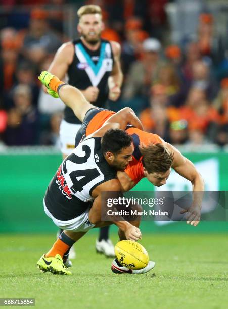Jarman Impey of the Power tackles Toby Greene of the Giants during the round four AFL match between the Greater Western Sydney Giants and the Port...