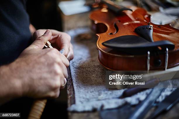 close-up of luthier in workshop at work - violin family stock pictures, royalty-free photos & images