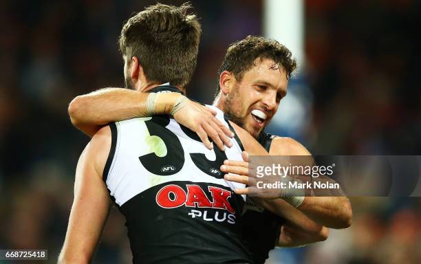 Justin Westhoff of the Power is congratulated after kicking a goal during the round four AFL match between the Greater Western Sydney Giants and the...