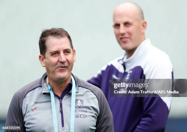 Ross Lyon, Senior Coach of the Dockers chats to David Hale, Development/Specialist Coach of the Dockers during the 2017 AFL round 04 match between...