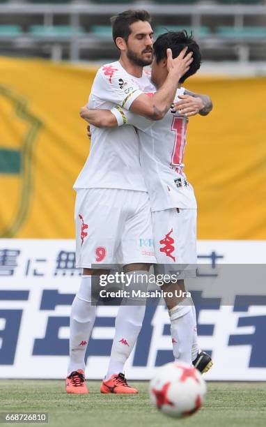 Joaquin Larrivey of JEF United Chiba celebrates scoring the opening goal with his team mate Yamato Machida during the J.League J2 match between...