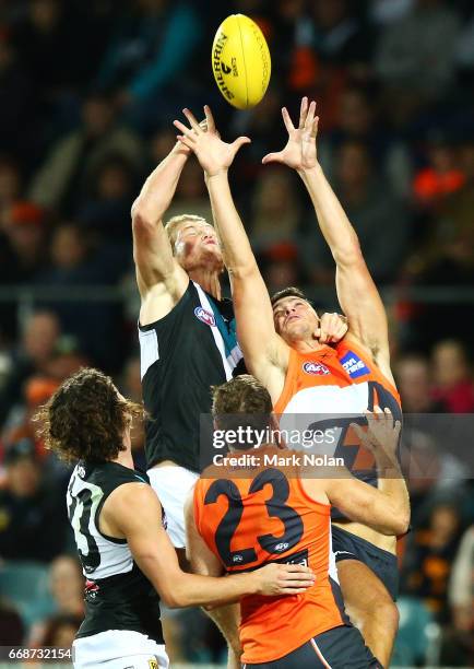 Jared Polec of the Power and Jonathan Patton of the Giants contest a mark during the round four AFL match between the Greater Western Sydney Giants...