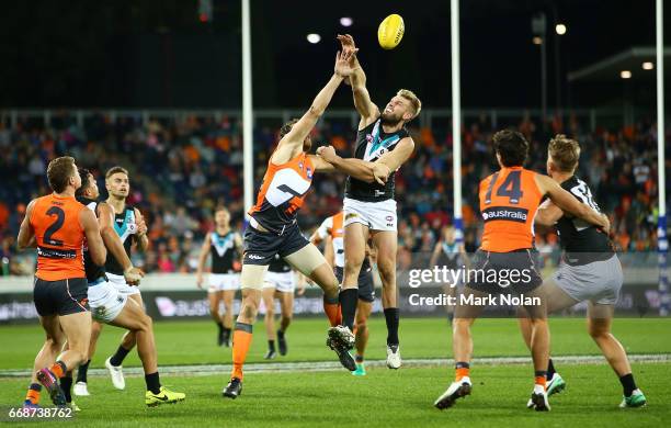 Shane Mumford of the Giants and Jackson Trengove of the Power contest possession during the round four AFL match between the Greater Western Sydney...