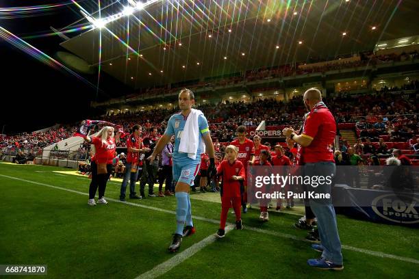 Eugene Galekovic of Adelaide leads his team onto the pitch during the round 27 A-League match between Adelaide United and the Western Sydney...