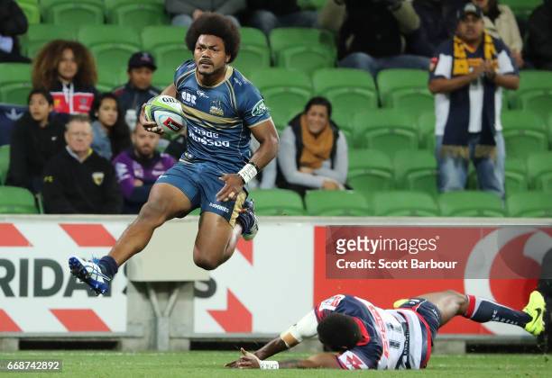 Henry Speight of the Brumbies runs in to score a try during the round eight Super Rugby match between the Rebels and the Brumbies at AAMI Park on...