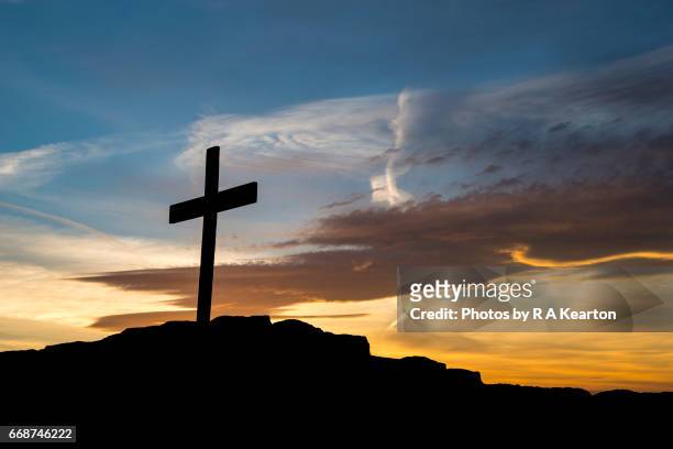 wooden cross on a hilltop at sunset - cross shape stock pictures, royalty-free photos & images