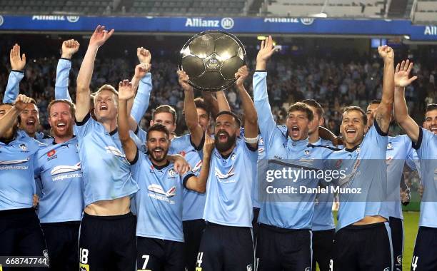 Sydney FC players celebrate with the Premiers Plate after the round 27 A-League match between Sydney FC and the Newcastle Jets at Allianz Stadium on...