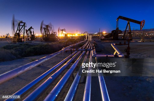 Long Exposure Shoot of Pump Jacks in Oil Field at Night